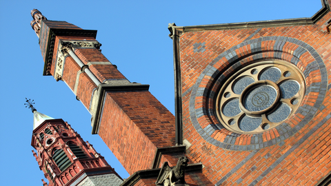 Ornate brick facade of the main building at Queen's University, Belfast.