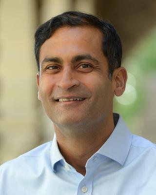 Headshot of Saumitra Jha 