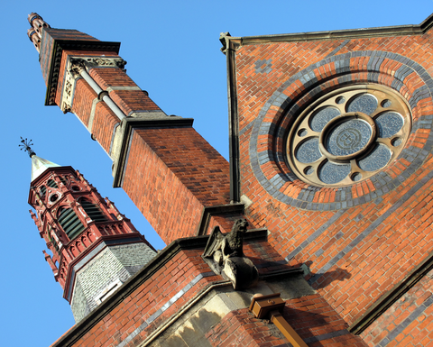 Ornate brick facade of the main building at Queen's University, Belfast.